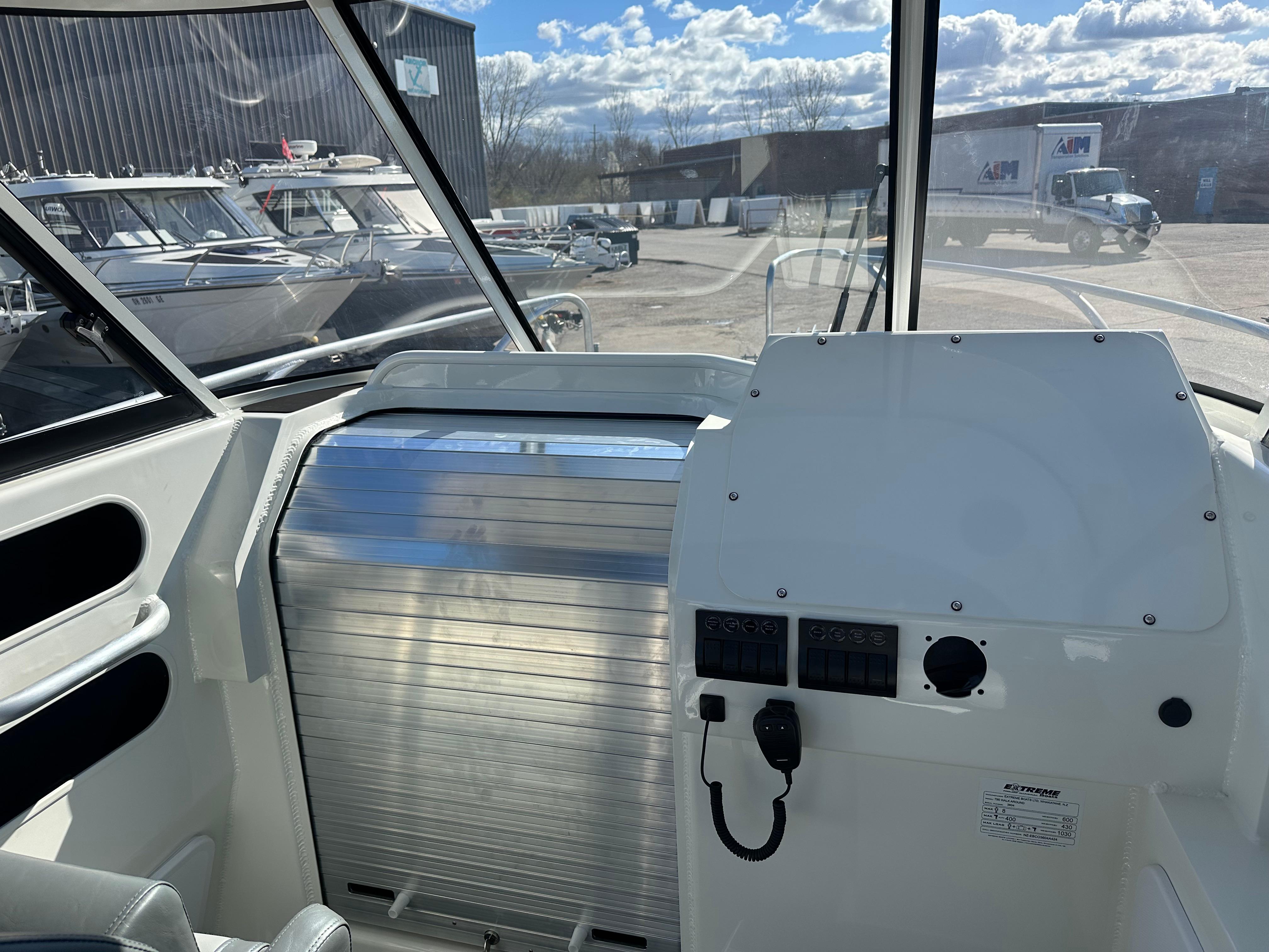 Helm and Cabin Rolling door on the 2024 Extreme Boats 795 Walk Around 26' for Sale by Parma Marine