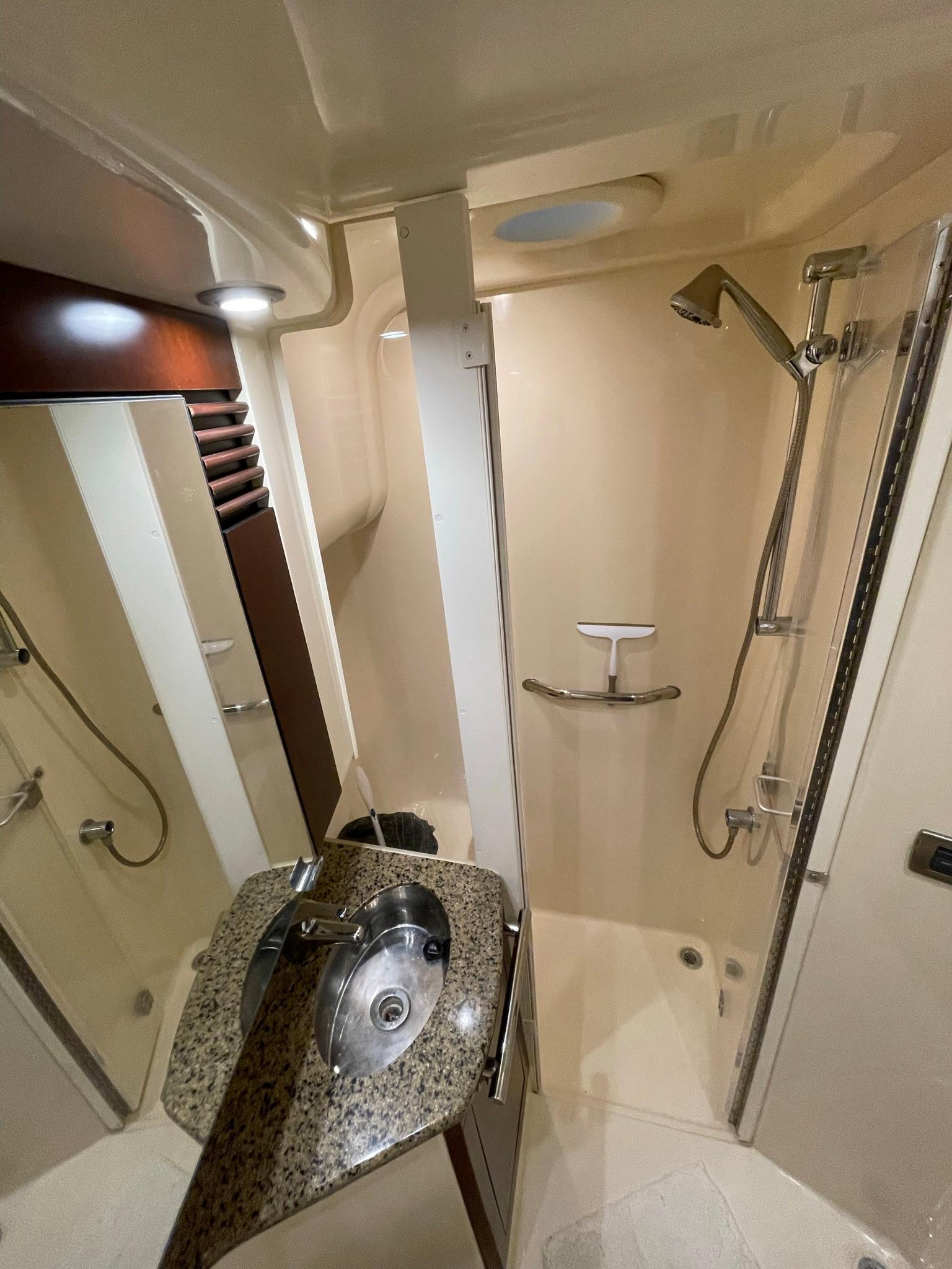 MASTER STATEROOM HEAD WITH SPEARATE STALL SHOWER & HARD DOOR