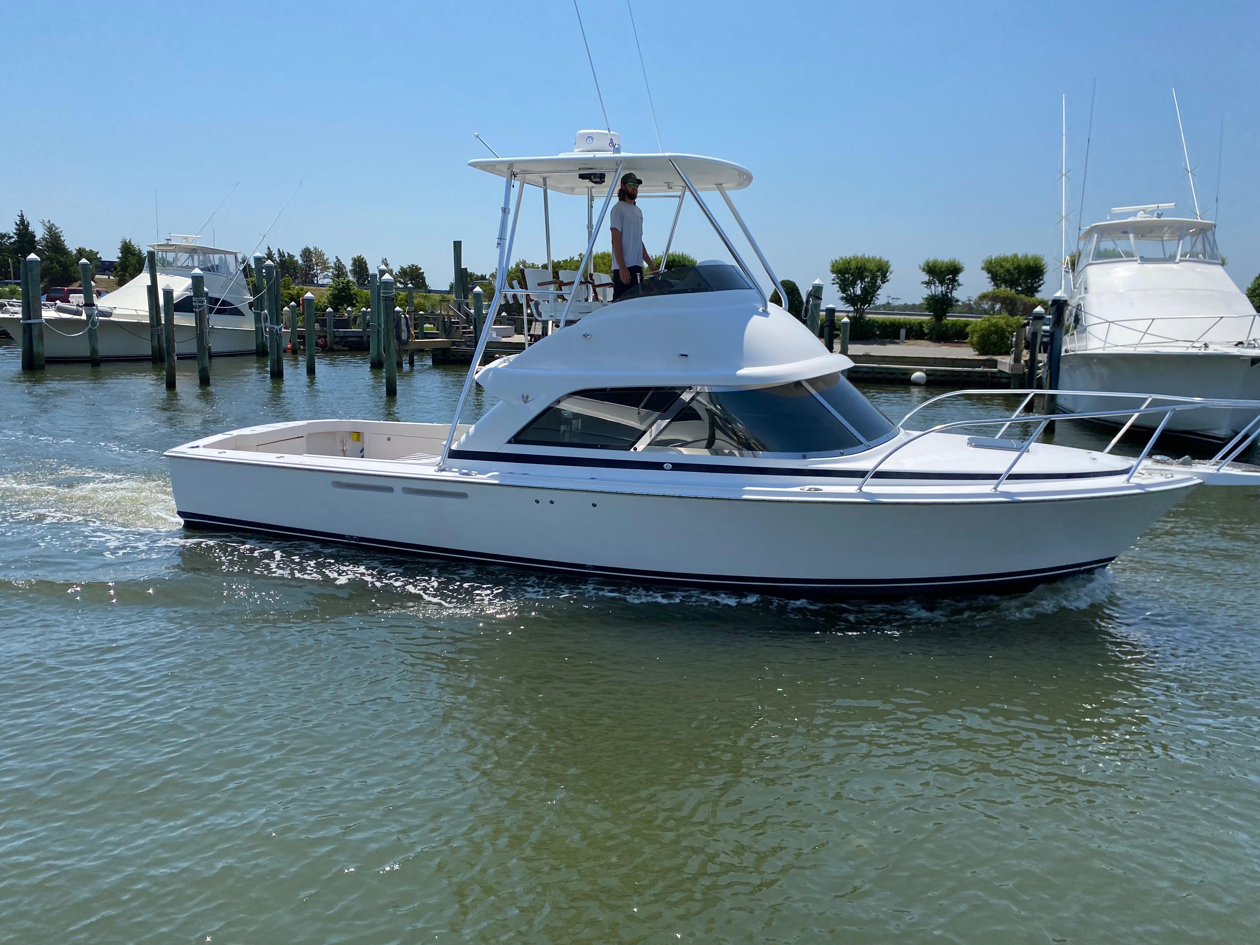 Flybridge cabinet black starboard rod and reel storage system