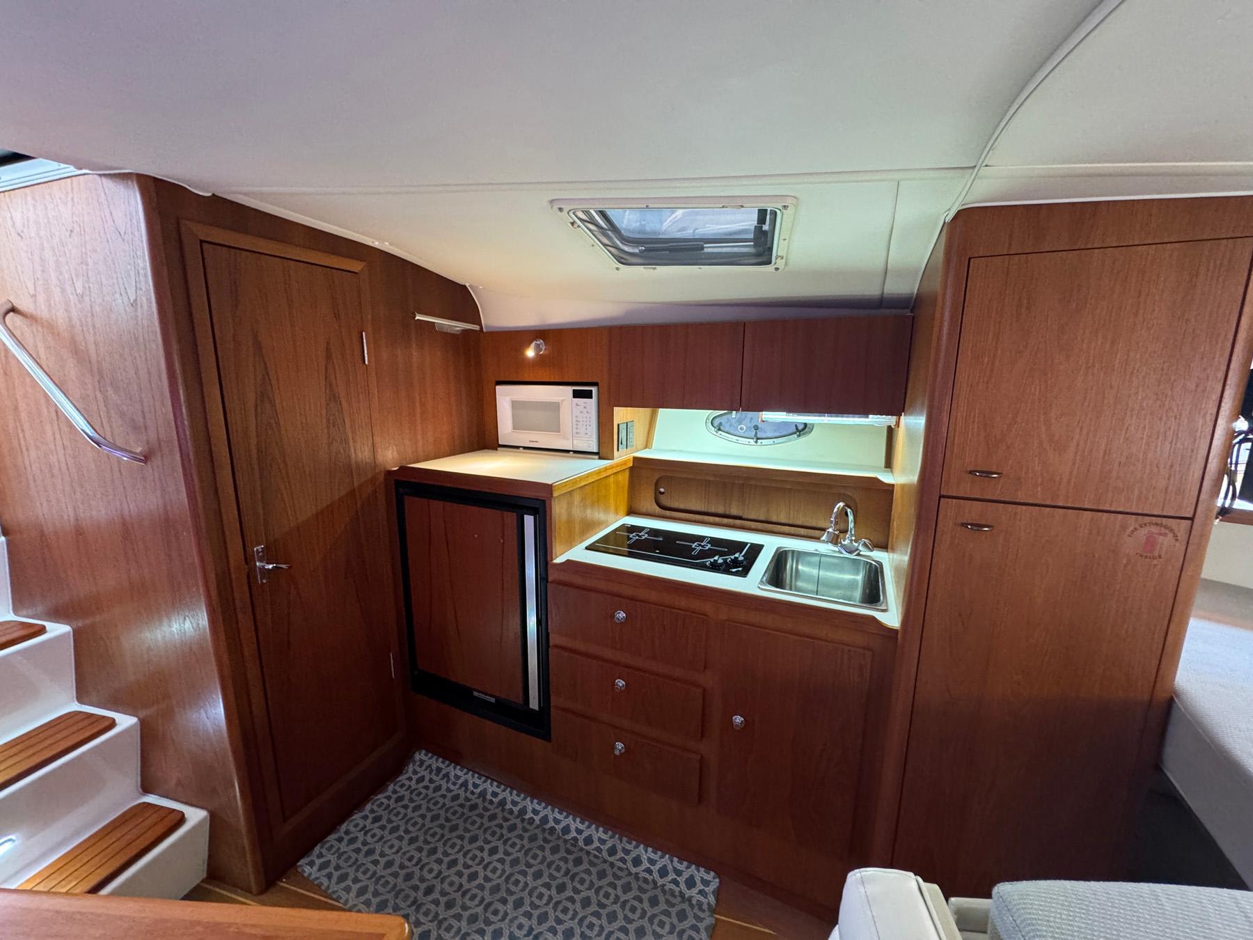 Galley with large refrigerator