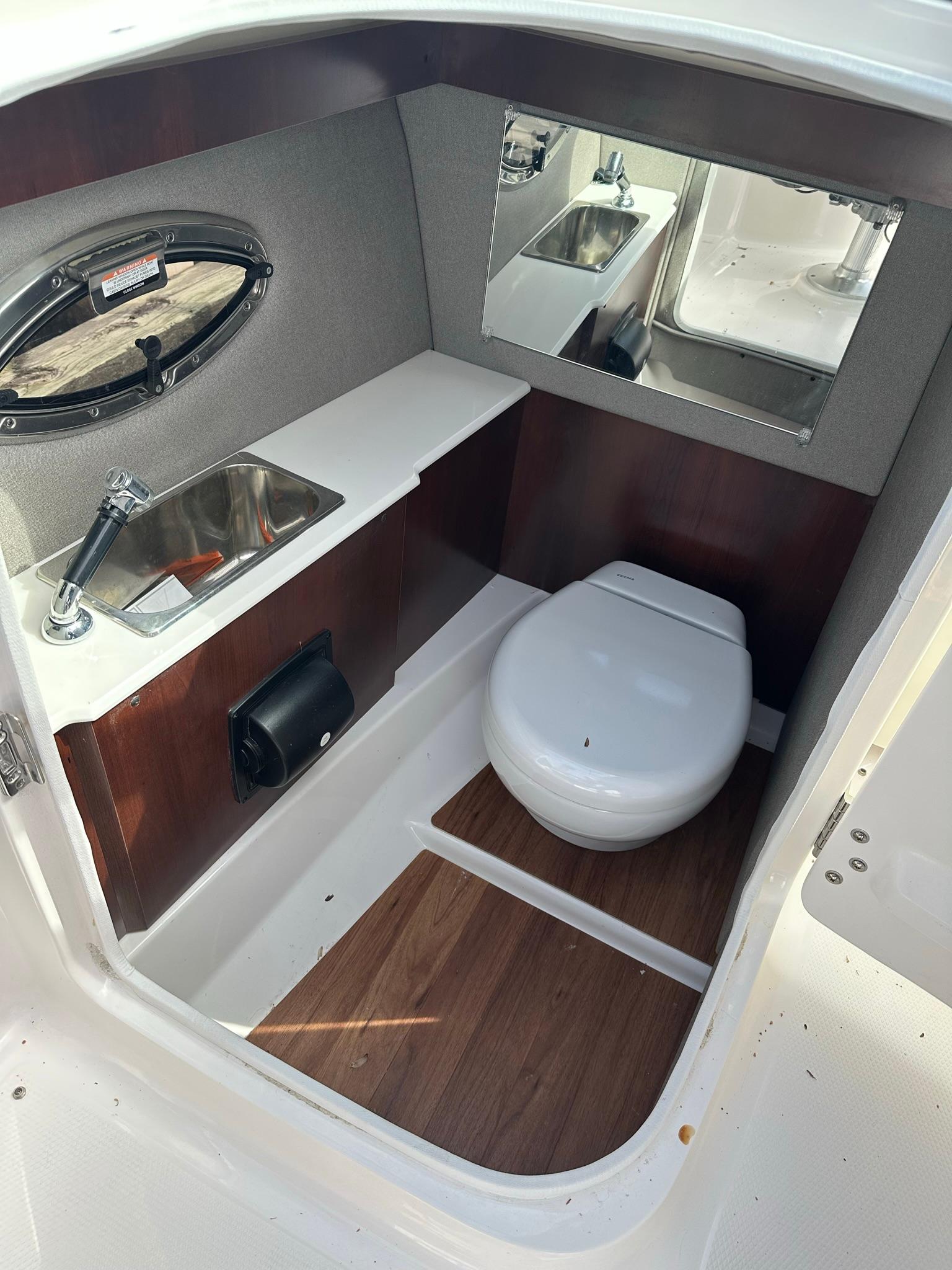 2022 Chaparral 267ssx OB, enclosed toilet and sink