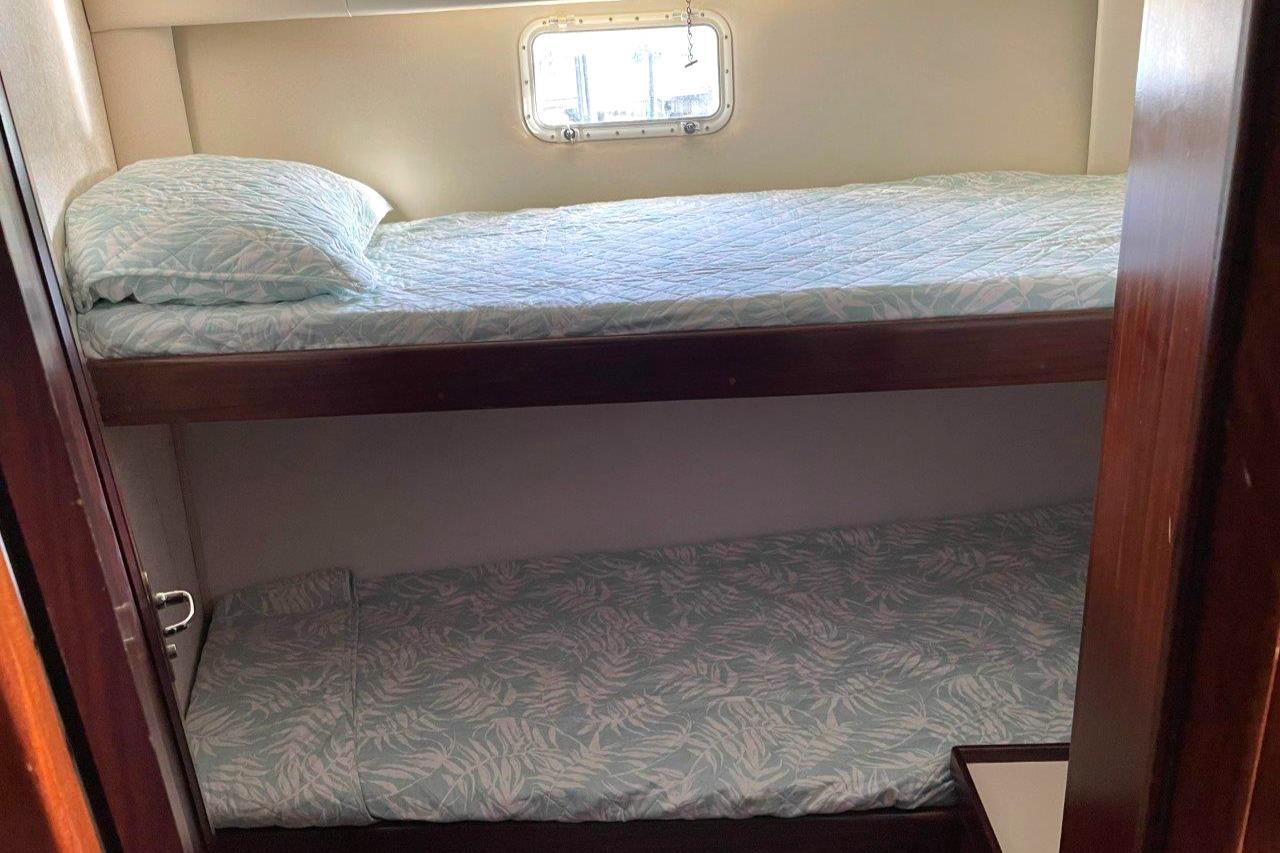 Guest stateroom bunks, new mattresses and bedspreads