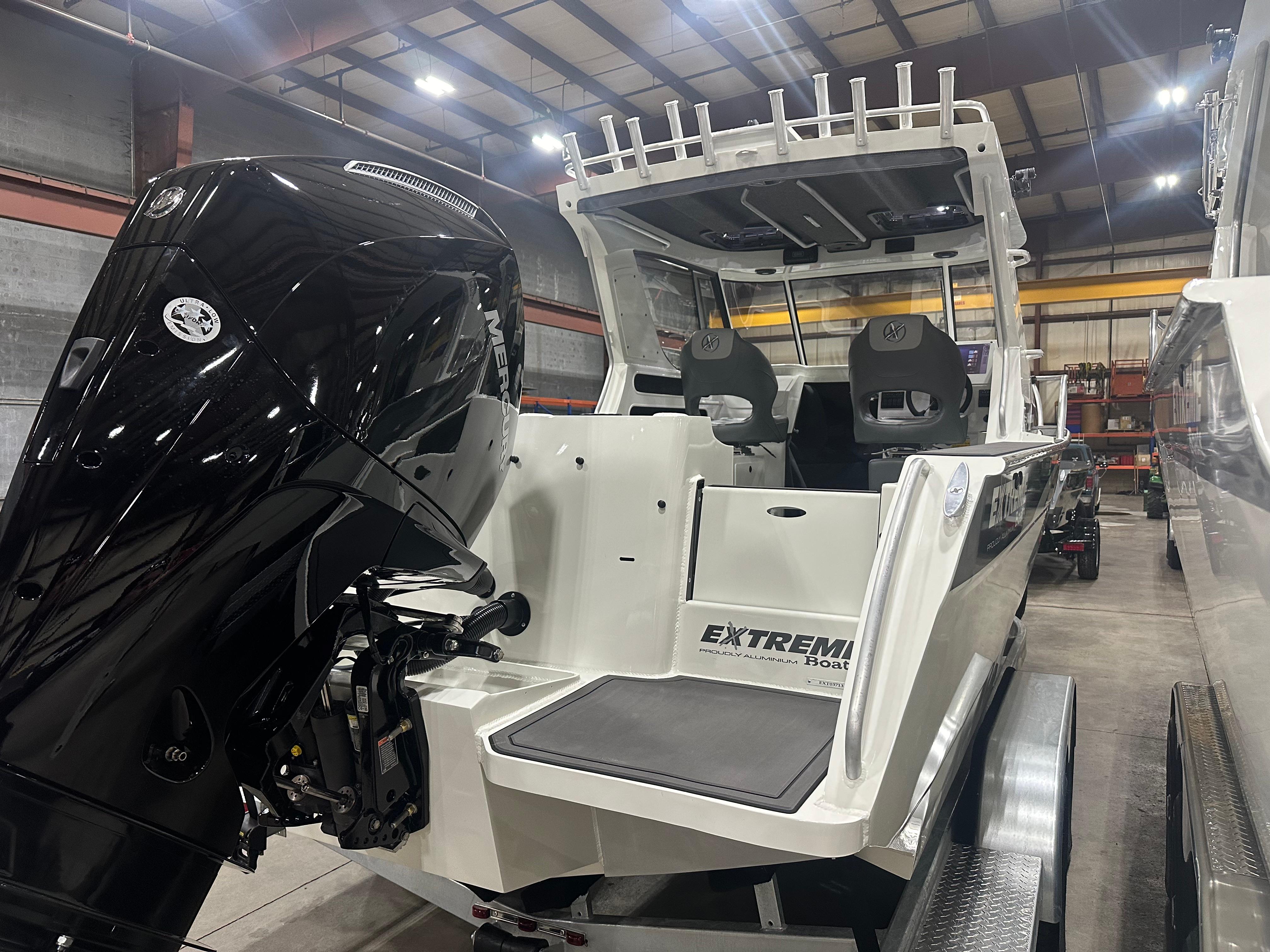 Undermount Ladder, Aquatraction Flooring, Double Rod Racking, Mercury Outboard on the New 2024 Extreme Boats 745 Game King