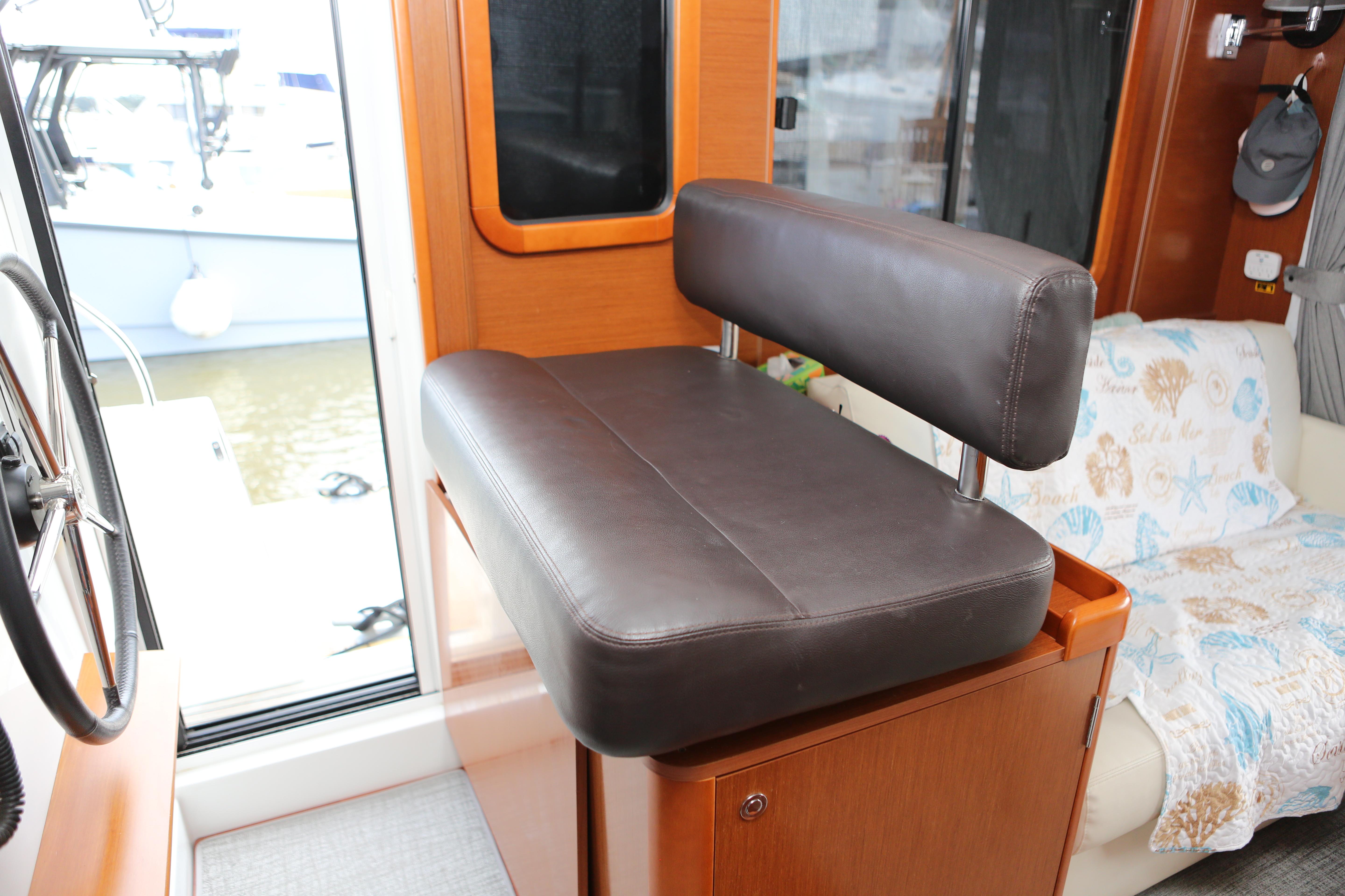 Movable helm seat