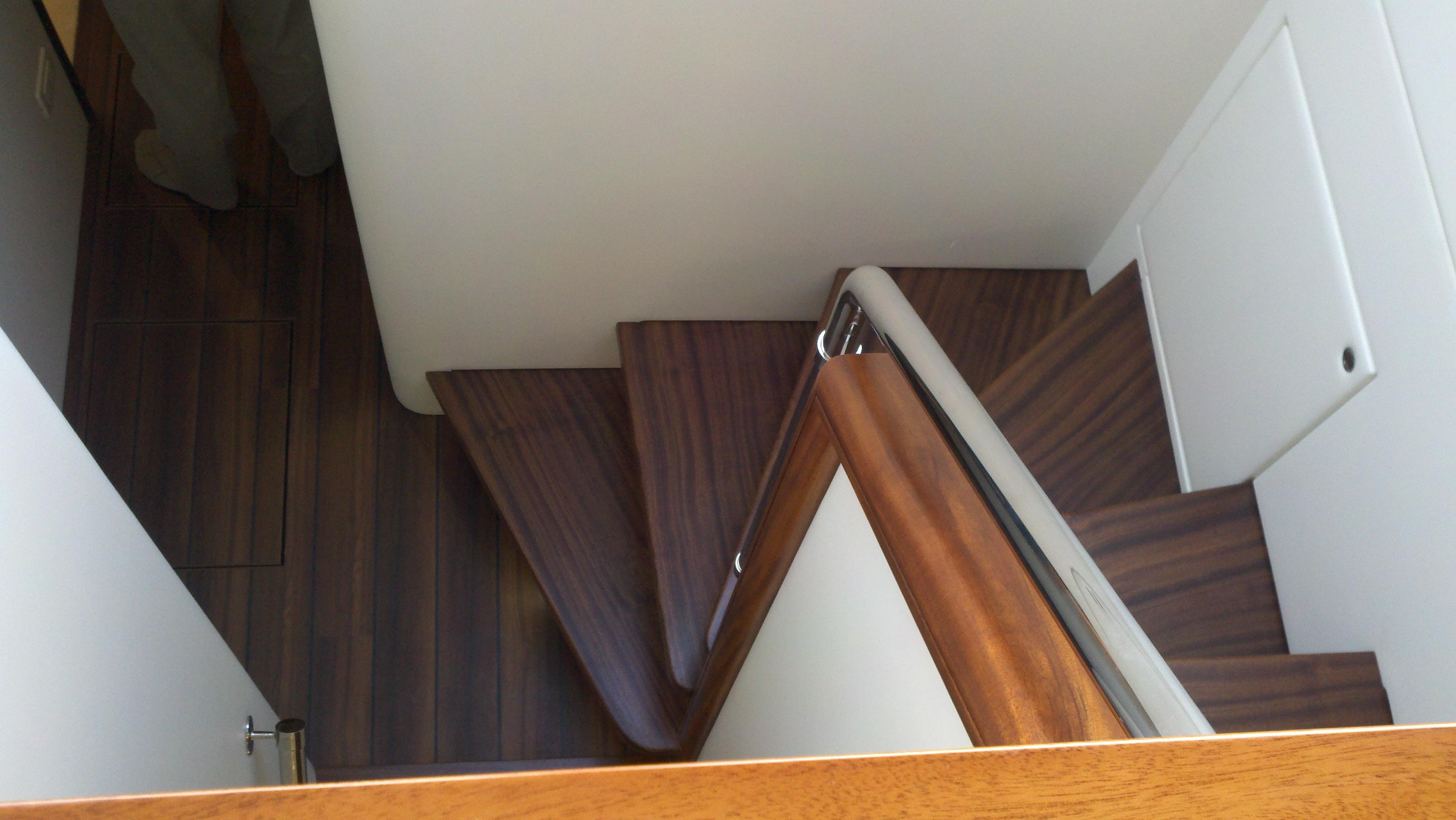 Companionway below with mahogany steps and custom flooring