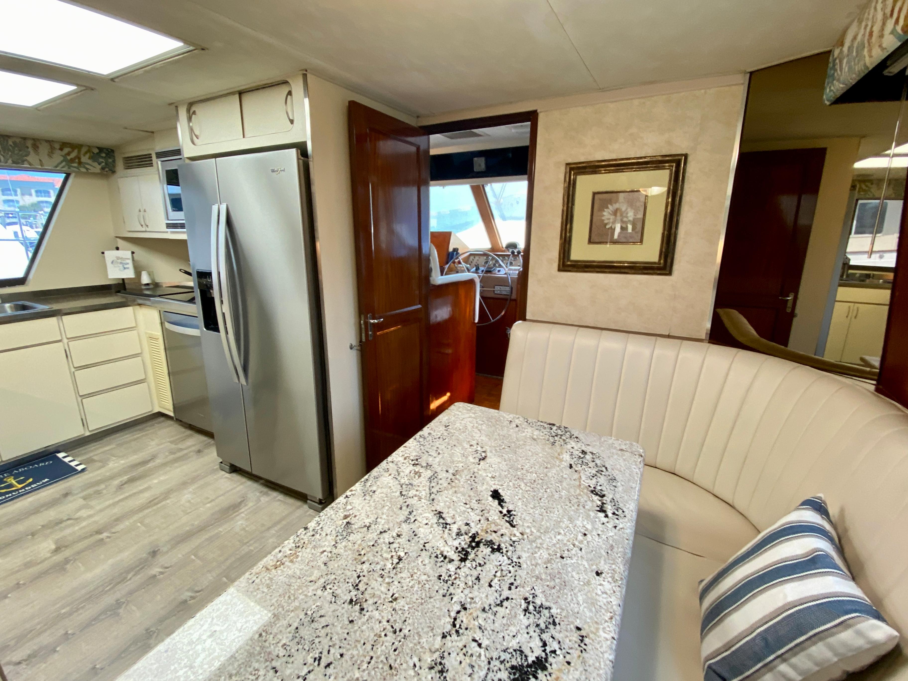 Hatteras 70 Conundrum - Dinette Table and Seating in Galley
