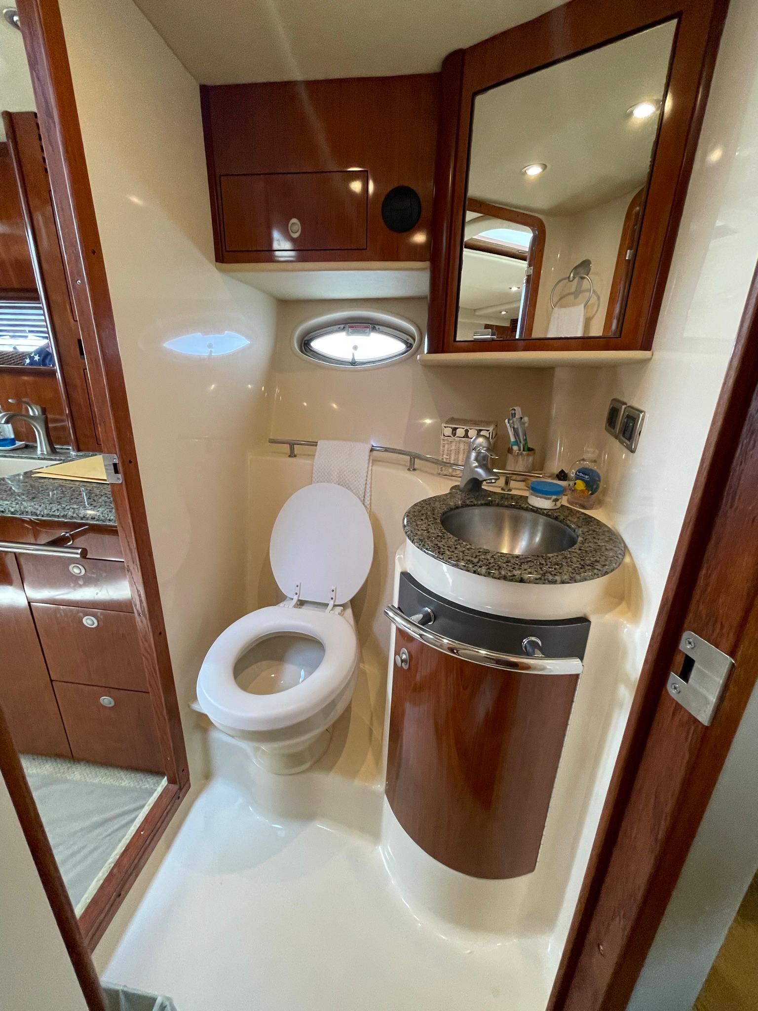 HEAD WITH VANITY, VACU-FLUSH FRESH WATER TOILET AND TWO ENTRANCES