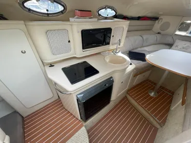 GALLEY TO PORT WITH DUAL VOLTAGE FRIDGE, MICROWAVE, ELECTRIC COOKTOP & HOT/COLD SINK