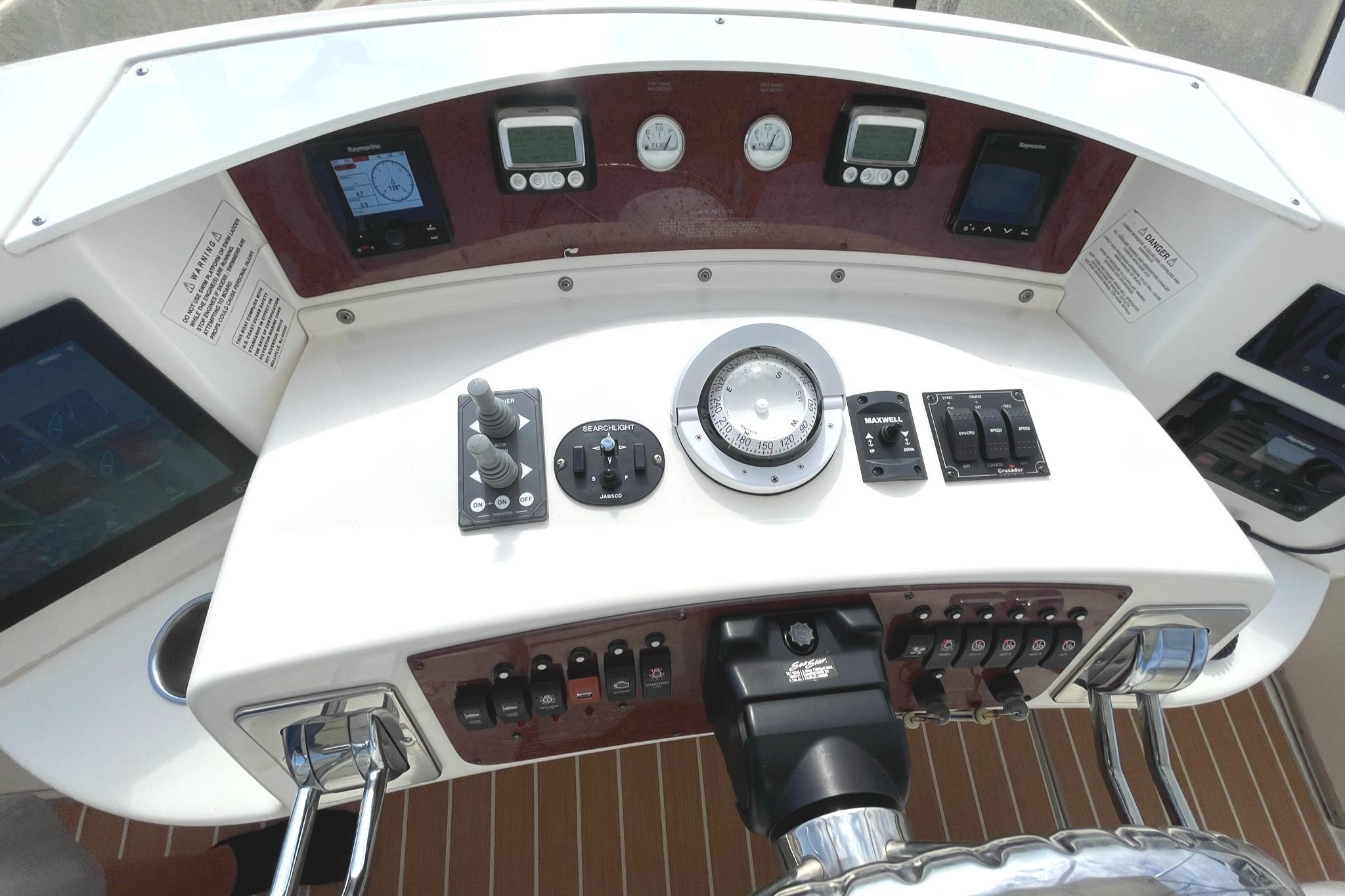 HELM W/ALL NEW GUAGES, SWITCHES, ELECTRONICS, CRUSADER ENGINE GAUGES, BOW & STERN THRUSTER CONTROLS, COMPASS, ETC