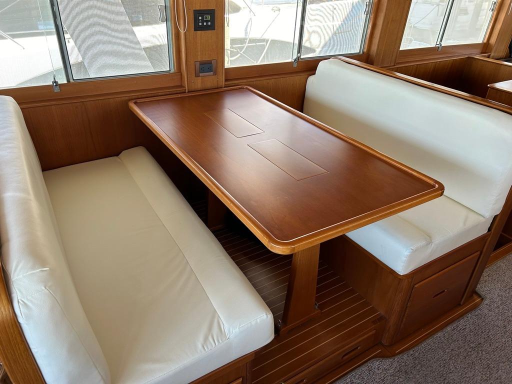Dinette Opposite Galley with Teak Table