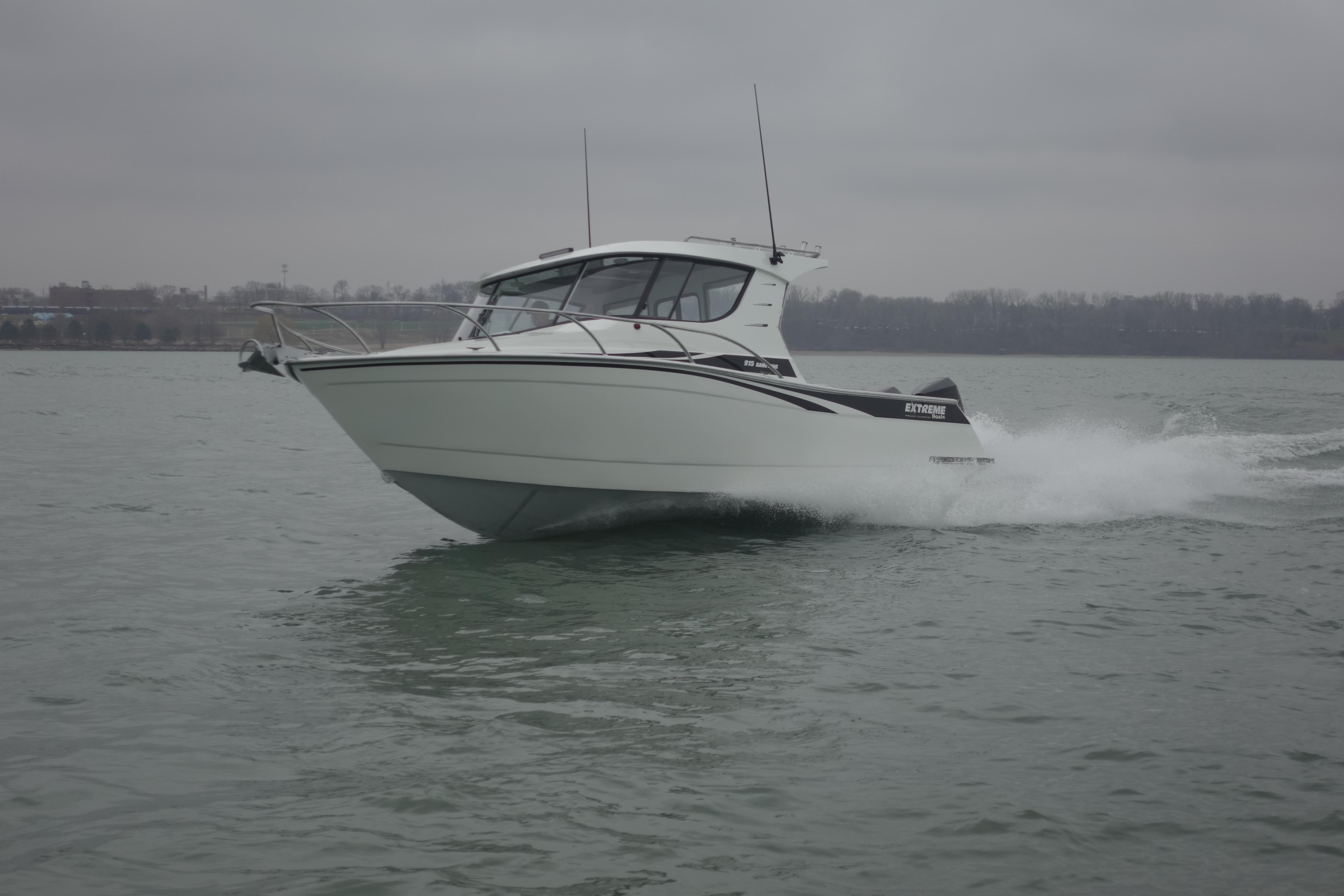 2021 Extreme Boats 915 30' Gameking (Great Shot of Reverse Chine Throwing water back down into the lake) 