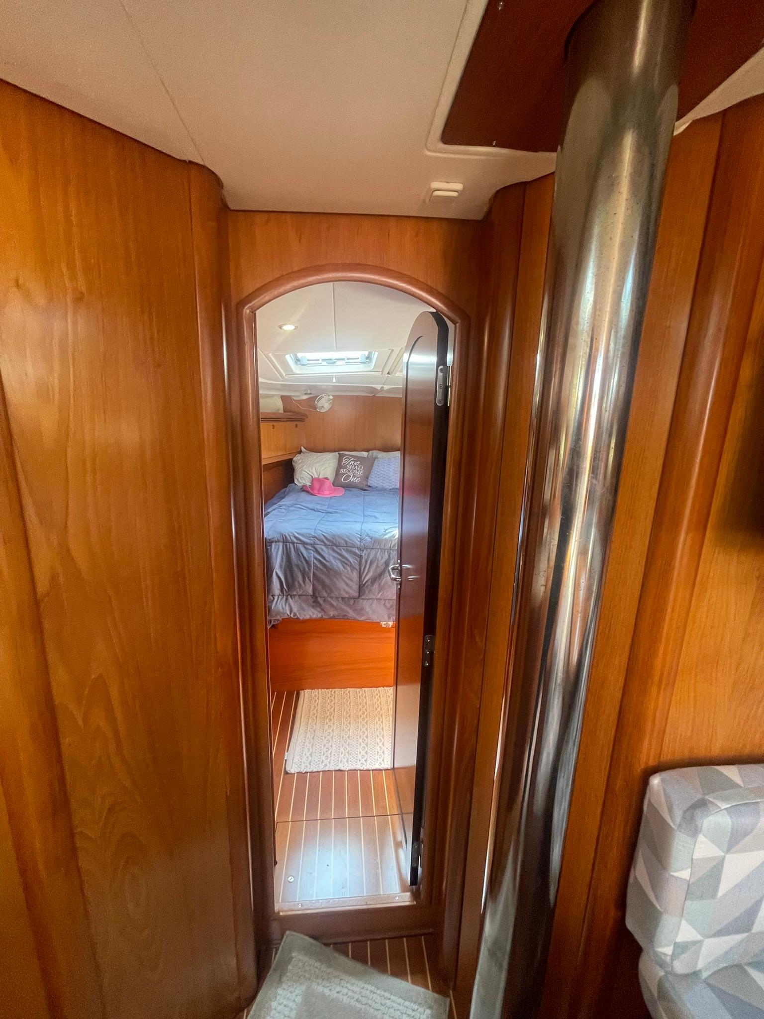 COMPANIONWAY FORWARD TO MASTER STATEROOM & PRIVATE HEAD W/SHOWER